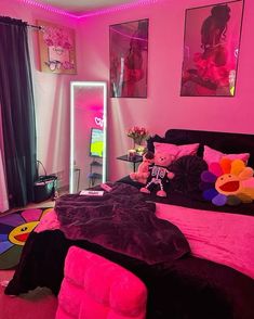 a bedroom with pink walls and black furniture