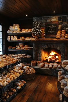 a bakery filled with lots of different types of doughnuts on shelves next to a fire