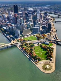 an aerial view of a city and the water