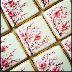 decorated cookies with pink flowers on them