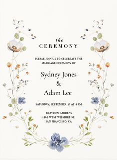 a wedding card with blue flowers and greenery