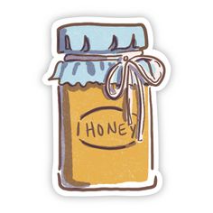 a sticker with the words honey written on it and a jar filled with honey