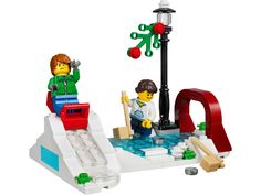 two legos are playing in the water on a white surface with red and green lights