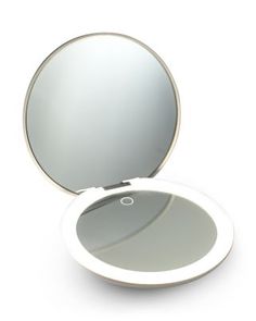 What It Is:A compact lighted mirror that includes both a 1x standard mirror and a 10x magnified mirror. It is a must-have for makeup and skincare touch-ups on the go. Featuring Ilios' signature lighting, you'll see every detail in true color for a flawless and color-correct look. The oversized 5 mirror lets you see your full face while still being light enough to throw in a purse or backpack. A built-in long-lasting rechargeable battery will keep you powered up for weeks (10+ hours of constant power).What It Does:- Dimmable.- Simulates true daylight.- 15-minute auto shut off.- Rechargeable long-lasting battery. Makeup Favorites, Lighted Mirror, Favorite Makeup Products, Makeup And Skincare, Compact Mirror, Full Face, Rechargeable Battery, Color Correction, Beauty Cosmetics