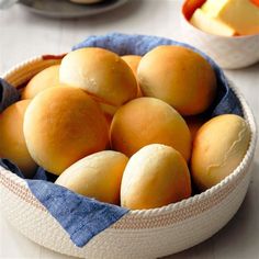 a bowl filled with lots of food on top of a white tablecloth covered table