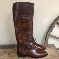 Equestrianriding Feild Boots. Fashionable Hand Tooled Leather, Handmade In Italy.Woman’s Size 8m. Vintage 80’s New In Original Box. Very Rare! Measurements: Length: 10 1/4” Width: 3 1/2” Shaft Height: 17” Circumference At Calf: 14” Circumference At Shaft Opening: 15” Condition Is Beautiful, Vintage, New With Original Box. No Noted Flaws On Boots. There Is Some Tape On The Original Box When It Was Tapped Shut For Moving. Please See Pictures & Measurements. Elegant Leather Sole Knee-high Boots For Riding, Western Style Leather Knee-high Boots For Formal Occasions, Leather Riding Knee-high Boots, Cozy Clothing, Equestrian Riding Boots, Tan Leather Boots, Wardrobe Pieces, Equestrian Riding, Cute Nike Shoes