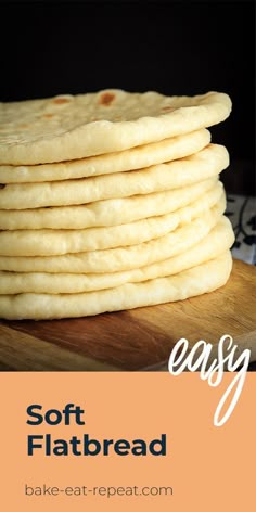 a stack of flatbreads sitting on top of a wooden cutting board with text overlay