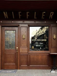 the entrance to a restaurant with wooden doors