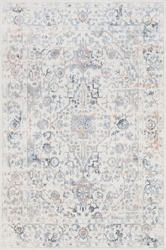 an area rug with various colors and designs on it, including blue, pink, orange and