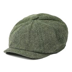 a green and black hat with a herring pattern on the brimmed cap, side view