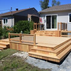 a wooden deck in front of a house