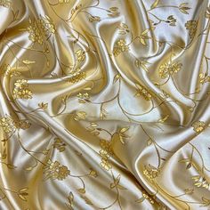 a gold and white floral print fabric