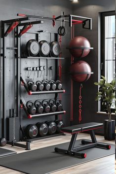 a gym room with exercise equipment and large windows