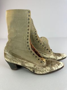 "Antique boots from the Victorian Edwardian era. They are fashioned of leather & Canvas and are/were beige in color. The condition is fair. These boots are missing the laces, and the leather is worn. They are still a great addition to your antique clothing collection!  MEASUREMENTS: (Measurements are taken outside of the boot) Heel to Toe: 9 1/2\" Bottom of sole at the widest point: 3\" The boots are 10\" high from the top of the boot to heel. SHIPPING: Once your order is processed you can expect your package to ship the next business day and arrive in 2 to 5 business days. MORE: Like what you see? Find more listings in my shop here: https://www.etsy.com/shop/mmmoonchild Message me if you have any more questions!" Victorian Boots With Leather Sole, Historical Round Toe Formal Boots, Historical Formal Boots With Round Toe, Historical Round Toe Boots For Formal Occasions, Vintage Lace-up Boots With Pointed Toe And Leather Sole, Vintage Lace-up Boots For Formal Occasions, Vintage Lace-up Boots With Cap Toe And Leather Sole, Vintage Lace-up Cap Toe Boots With Leather Sole, Victorian Boots With Leather Sole For Fall