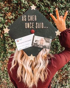 a woman wearing a graduation cap with the words as cheer once said written on it