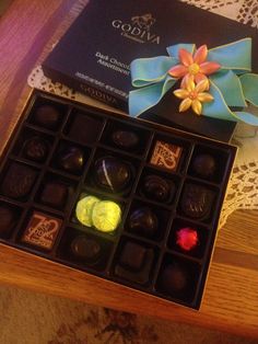 an open box of chocolates on a table