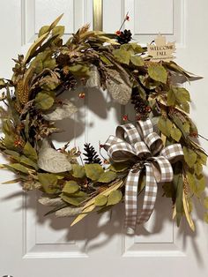 a wreath is hanging on the front door