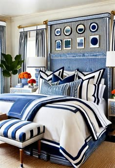 a bedroom with blue and white striped bedding