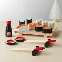 sushi and chopsticks are arranged on a table