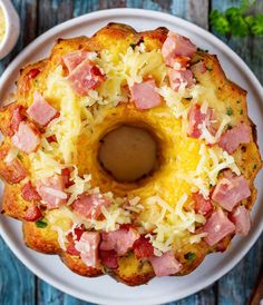 ham and cheese pull apart cake on a white plate