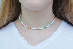 "This colorful and fun necklace reminds me of making bright tie-dye T-shirts in the summer! I love the stylish colors of this necklace. It's beachy and a perfect accessory to wear! This necklace is 16\" long on strong durable stretchy string.  Wear this necklace to accessorize your amazing summer style!" Fun White Beaded Necklaces For Summer, Casual Rainbow Necklace, White Fun Necklace For Festival, White Fun Style Necklace For Festivals, White Hippie Necklace For Gift, Fun White Necklace For Festival, Hippie White Necklace For Gift, Hippie White Necklace As Gift, Hippie White Necklace Gift