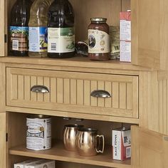 an open cabinet with many items on it