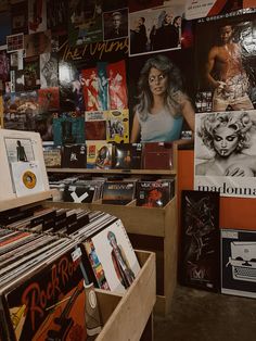 an old record store with various records on the wall and posters on the walls behind it