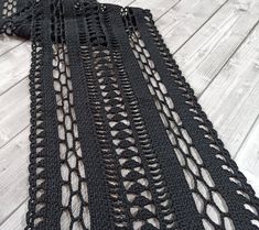 Enhance the cozy atmosphere of your home with this exquisite Black Crochet Lace Coffee Table Runner. Designed with meticulous craftsmanship, this table runner adds a touch of elegance and charm to any coffee table or dining area. Measuring 11.75 inches in width, this table runner is available in custom lengths, allowing you to find the perfect fit for your table. Handcrafted with love and attention to detail, it showcases a delicate crochet lace pattern that adds a timeless beauty to your dark academia decor. Made from high-quality black yarn, this coffee table runner offers a subtle and sophisticated touch to your space. Its versatile design complements a wide range of interior styles, from farmhouse and cottage to bohemian and traditional. Not only does this table runner elevate the aest Black Lace Table, Gothic Homes, Coffee Table Runner, Lace Table Runner, Academia Decor, Dark Academia Decor, Delicate Crochet, Lace Table Runners, Crochet Lace Pattern