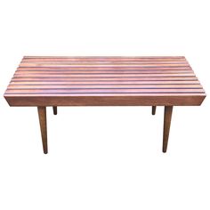 a wooden table that is sitting on top of a white background