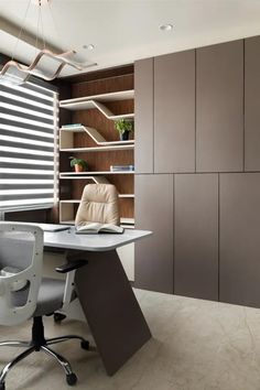 an office with a desk, chair and book shelf