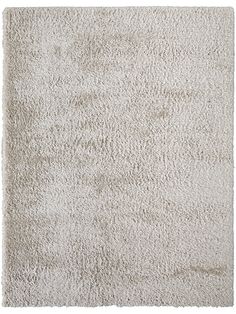 a white area rug with an uneven design