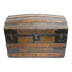 an old wooden trunk with metal handles and latches on the top, isolated against a white background