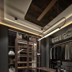 a walk in closet with shelves and drawers