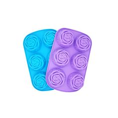 two blue and purple muffin trays with rose shaped icing in them on a white background