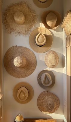 many hats are hanging on the wall