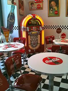 a room filled with coca cola machines and tables