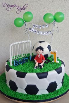 a birthday cake with a soccer theme on it