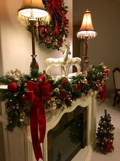 a fireplace decorated with christmas decorations and lights