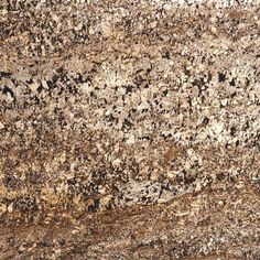 a granite counter top with brown and white colors