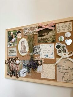 a cork board with pictures and magnets on it