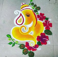 an elephant is painted on the ground with flowers