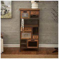 a tall wooden shelf with many drawers