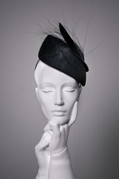 Sara is a felt percher hat, made from beautiful high-quality velour felt.   This elegant cocktail hat is finished with a modern feather detail. The hat modelled is shown in 'Midnight'.  The hat can also be made in lots of additional colours*. This hat is high at the crown and would suit the following face shapes: oval, round, square, and heart.  Please ask if you would like advice on styling before purchasing. Hat Details: * The hat secures with a metal comb and millinery headband, this can be d Luxury Elegant Flat Bill Hat, Modern Halo Hats, Elegant Curved Brim Felt Hat For Evening, Elegant Evening Felt Hat With Curved Brim, Adjustable Brimmed Felt Hat For Evening, Chic Evening Felt Hat For Kentucky Derby, Evening Mini Hat With Feather Trim And Curved Brim, Adjustable Felt Hat For Party, Adjustable Felt Hat For Parties