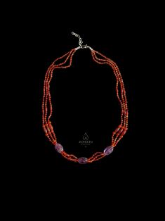 Featuring carnelian and amethyst gemstones as well as sterling silver, this one-of-a-kind necklace is a reproduction of an ancient Minoan piece. It is ethically handcrafted in my tiny silversmithing studio. Three elongated melon shaped beads, at the center of this necklace, are carved from natural high quality amethyst gemstone. These are reproductions of the ancient beads. The design is completed by stringing these large beads together with bicone and sphere shaped natural carnelian beads on triple strands of waxed nylon cord, which is a very durable material. At both ends of the necklace there is hook and eye closures handmade of sterling silver.  The steering silver extension chain allows you to adjust the length of this piece in accordance with your personal preference.  This one-of-a- Traditional Carnelian Gemstone Jewelry, Traditional Purple Jewelry With Polished Beads, Orange Gemstone Beads And Cabochons For Gifts, Orange Gemstone Beads And Cabochons As Gifts, Bohemian Carnelian Beaded Necklace With Faceted Beads, Carnelian Gemstone Amulet Jewelry, Spiritual Carnelian Gemstone Beads Jewelry, Bohemian Carnelian Beaded Jewelry, Traditional Orange Gemstone Jewelry