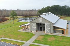 an aerial view of a barn and parking lot