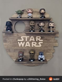 the star wars collection is displayed on a wooden shelf