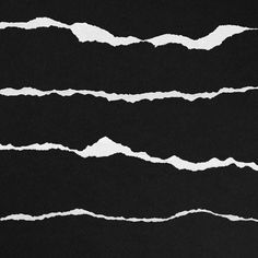 white lines drawn on black paper in the shape of mountains