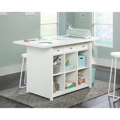 a white desk with several shelves and drawers