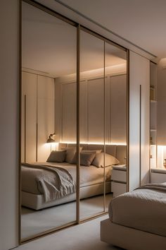 a bedroom with mirrored closet doors and a bed