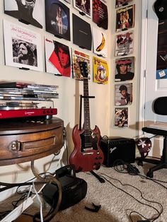 a room filled with lots of different types of musical equipment and pictures on the wall